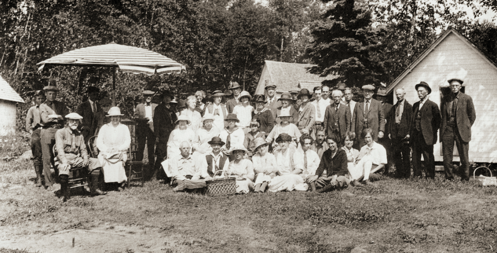 The Isle Royale Property Owners’ Association, with families, at Rock Harbor Lodge, 1925. Summer residents and resort owners organized in 1922, when 65,000 acres of land were sold to a Minnesota lumber company; there were fears that the recreational qualities of the island might be damaged. Reorganized as the Isle Royale Protective Association in 1931, the group supported the idea of a national park but sought to protect its interests by calling for regulation of commercial fishing to protect sport fishing and life leases for summer residents, their children, and grandchildren. Photograph from Isle Royale A Photographic History, by Thomas and Kendra Gale.