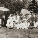 The Isle Royale Property Owners’ Association, with families, at Rock Harbor Lodge, 1925. Summer residents and resort owners organized in 1922, when 65,000 acres of land were sold to a Minnesota lumber company; there were fears that the recreational qualities of the island might be damaged. Reorganized as the Isle Royale Protective Association in 1931, the group supported the idea of a national park but sought to protect its interests by calling for regulation of commercial fishing to protect sport fishing and life leases for summer residents, their children, and grandchildren. Photograph from Isle Royale A Photographic History, by Thomas and Kendra Gale.