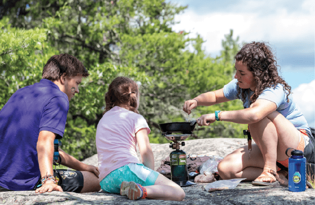 Campers at YMCA Camp du Nord learn the essential skill of cooking in the wilderness. All photos courtesy YMCA Camp du Nord.