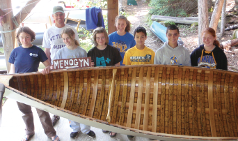 Groups that come to Camp Menogyn learn about wood canvas canoes in Mengoyn’s own ‘York Factory’ canoe shop. Photo courtesy of Camp Menogyn.