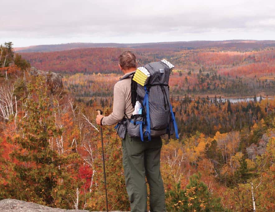 Admiring an autumn view on the Superior Hiking Trail near Finland. Photo by Dave Noll.