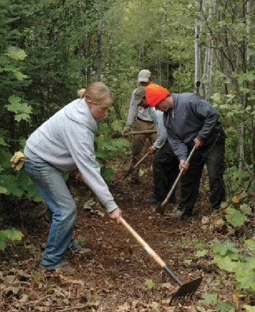 Volunteers use tools called McLeods to clear the tread on the Superior Hiking Trail. Photo by Mark VanHornweder, courtesy Superior Hiking Trail Association.