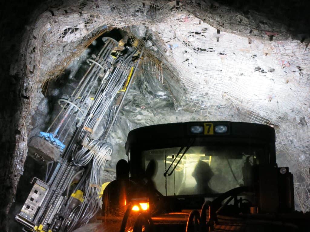 A highly automated, jumbo drill machine installs wire mesh support at Teck’s Pogo underground gold mine in central Alaska, USA. (Photo courtesy University of Exeter via Flickr)