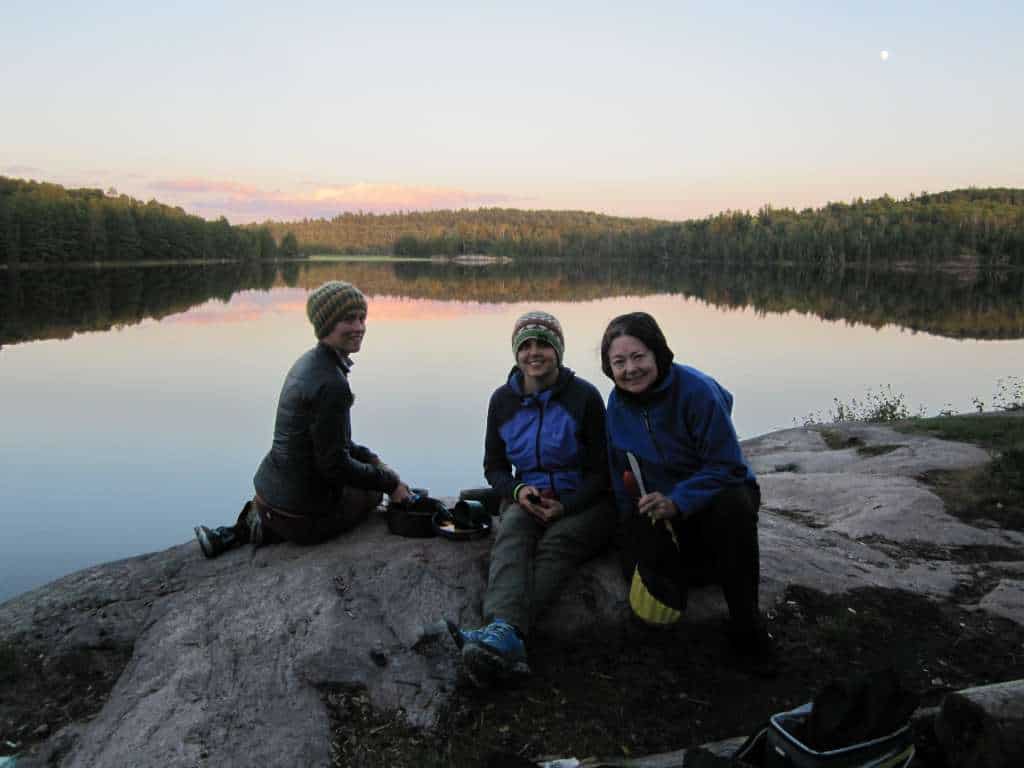 Sherelyn Ogden and friends enjoy a crisp, cool evening on Lower Pauness Lake in the Boundary Waters Canoe Area Wilderness. Photo courtesy Jenna Bluhm.