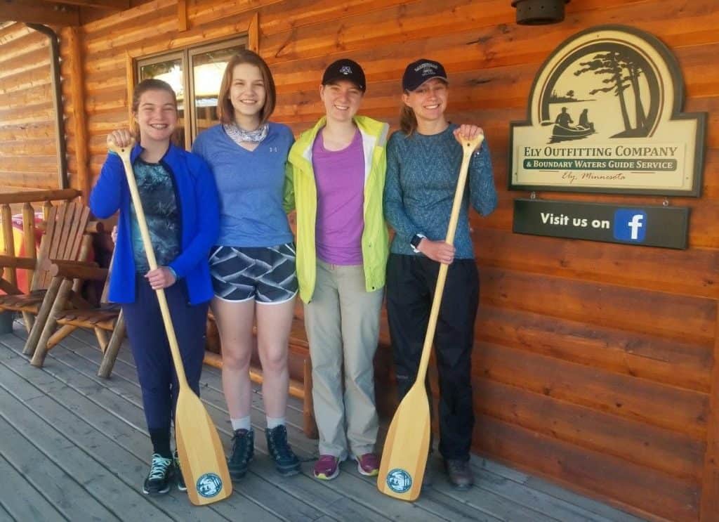 The winner of the first annual Boundary Waters Teen Essay Contest was Julia Ruelle (wearing the yellow jacket, above). (Photo courtesy Ely Outfitting Co.)