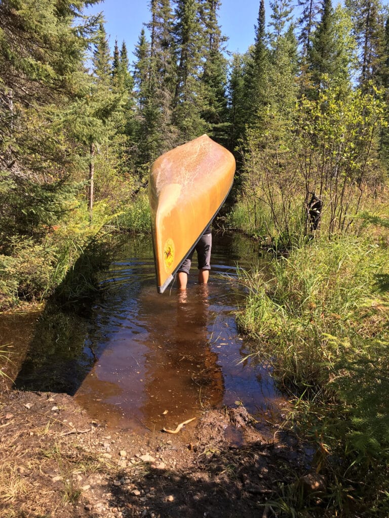 Portaging a canoe in the Boundary Waters. Photo by Holly Scherer.