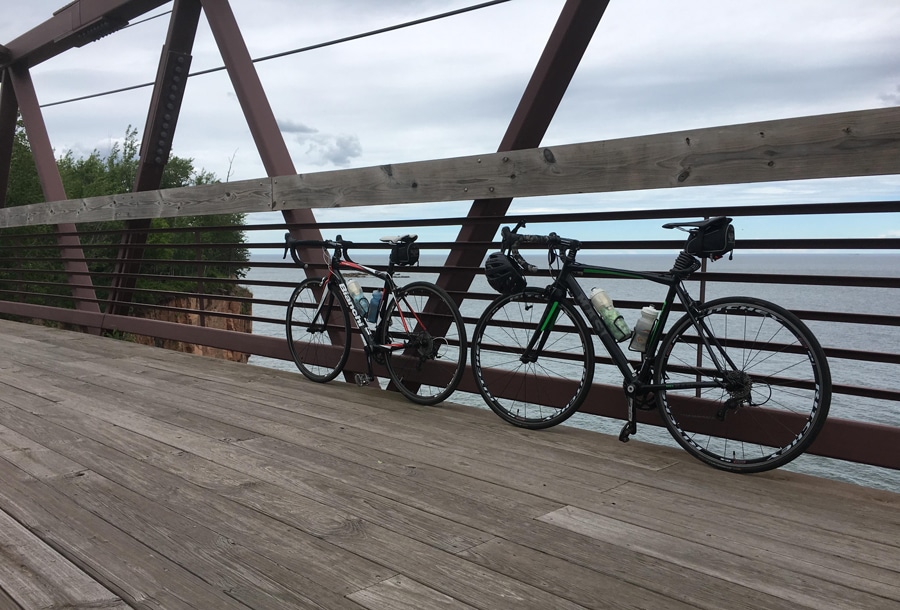 Biking the Gitchi-Gami Trail Bridge near Iona's Beach