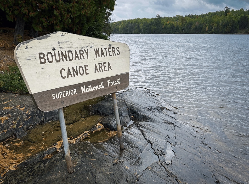 Sign for BWCA along a lake shore