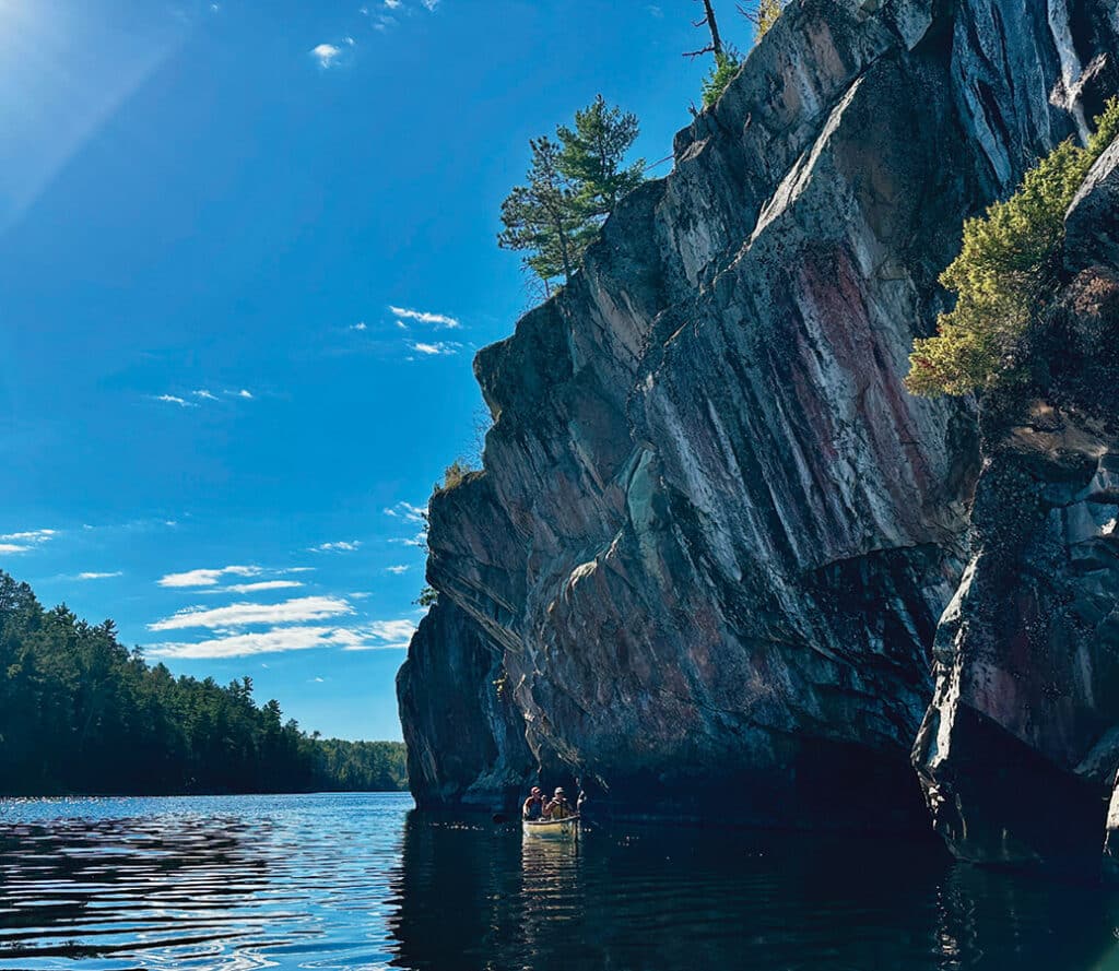 Paddlers view the Crooked Lake pictographs