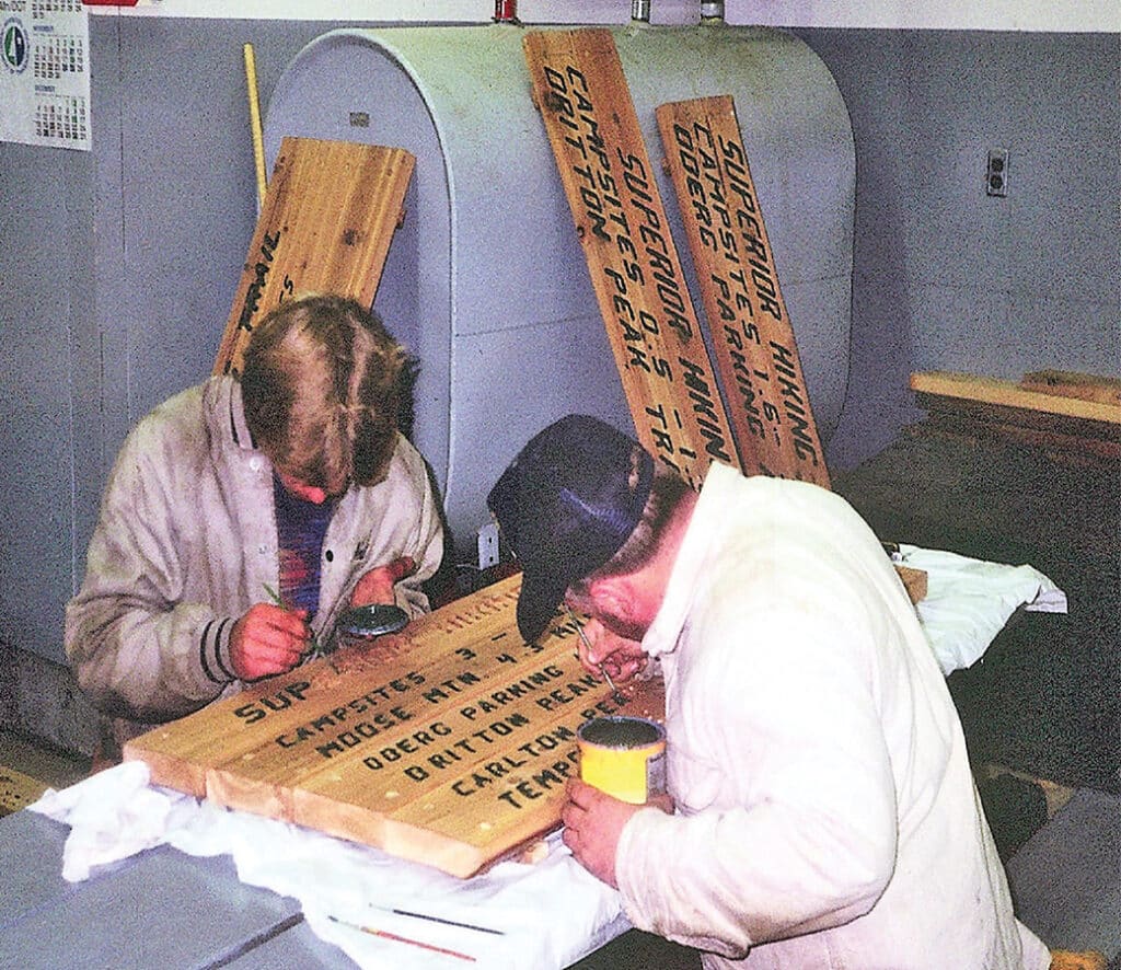 Historical Photo of people making hiking trail signs