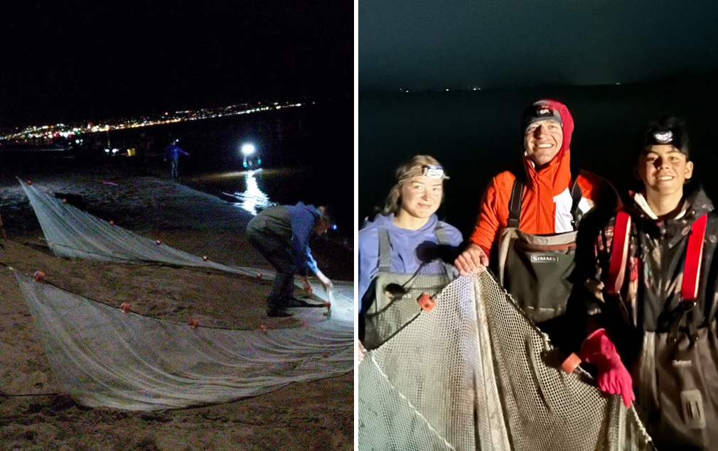 People catching smelt with nets on Lake Superior beach at night