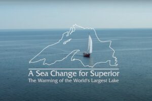 Sea Change for Lake Superior a sailboat shown with a map and documentary title