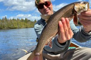 Author holds a lake trout caught in the BWCA
